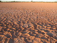 The sun goes down on the dry valley floor